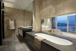 Licycon Honed floor and bath surround, Rocca Bianca walls.jpg