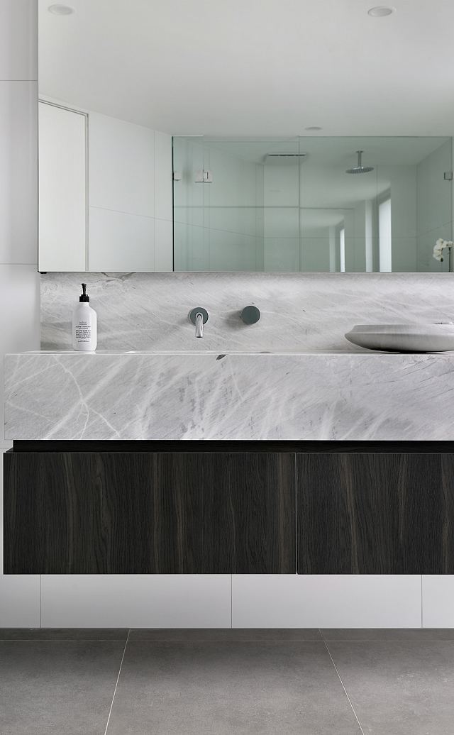 Fjord Grey Natural to floor and Elba Honed marble to vanity. Ashburton Residence by De Arch Architects