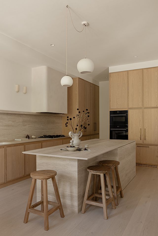​Artetech Pietra Avorio kitchen island, benchtop and splashback at Bishops Ave by Kate Lawrence Interiors​. Photography Nat​ Spada​
