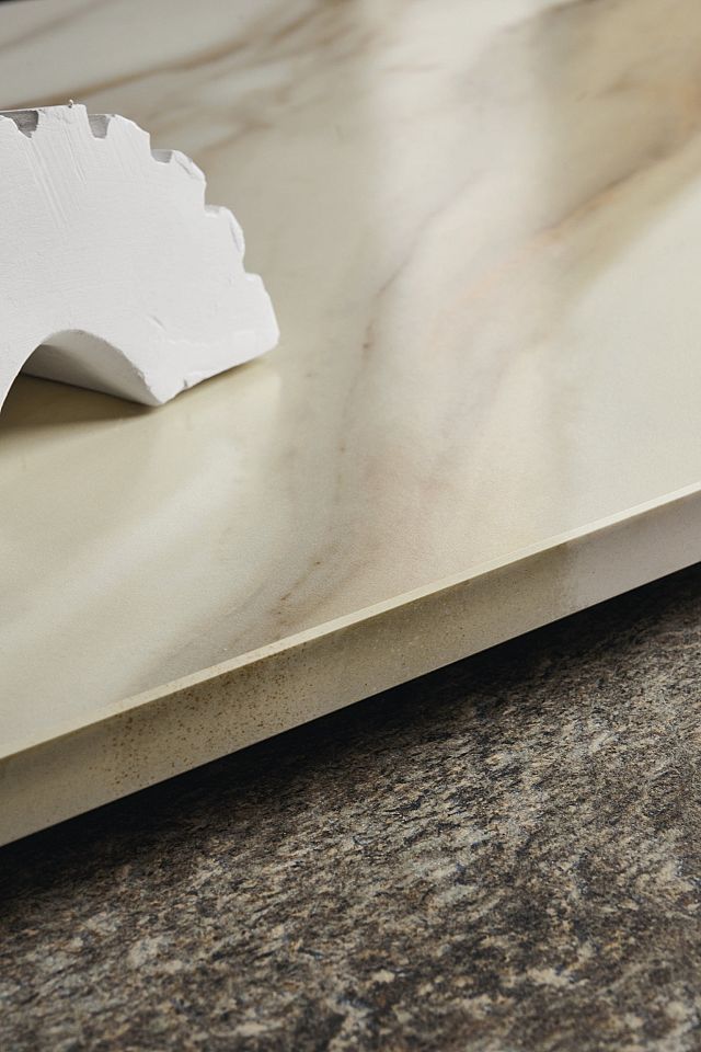 Maximum Calcatta Aureo porcelain stoneware beautifully replicates the allure of marble with its cream background and gold veins