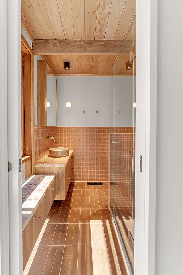 Tiberio, Italian marble with red hues, as benchtop, Arrotato Da Crudo Tobacco floors and Vixel, glass mosaic with terracotta hues, as feature walls