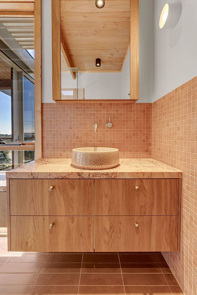 Vixel R.26 paper-faced glass mosaics used as feature walls and Cotto Manetti Arrotato Da Crudo Tobacco 280x70x15mm terracotta floors at Highton House. Project designed by Workshop by RA and built by BCT