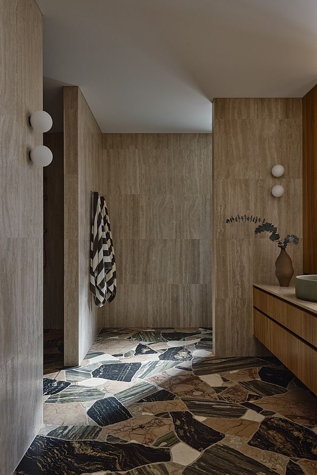 Travertine Lait wall and Tiberio, Verde Bardini, Zaragoza, Belvedere floor at Avocado House by HGA Studio. Photos by Derek Swalwell