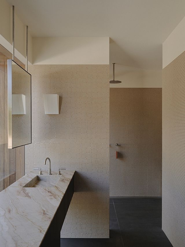 Arute Mono MM-15 15x15mm mosaics, Qariza stone vanity, and Beton Brown Concrete tiled floor at Field House designed by Olive Cooke and built by Henry Tervenski of Morada Build. Architecture by Fraser Mudge Architects. Photography by Tom Ross