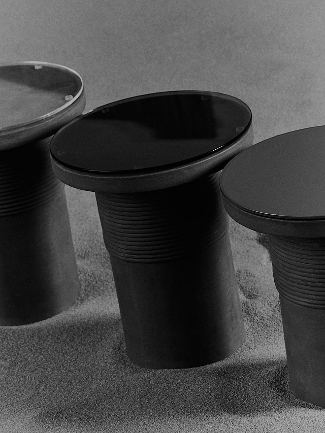 Bound Table designed by Locki Humphrey for New Volumes in marrone terracotta with glass top