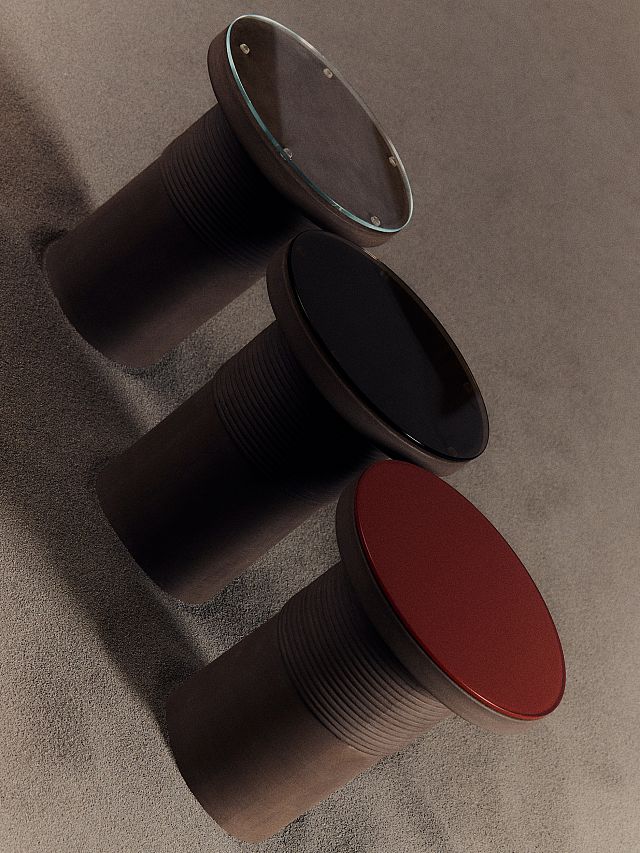 Bound Table designed by Locki Humphrey for New Volumes in marrone terracotta with glass top