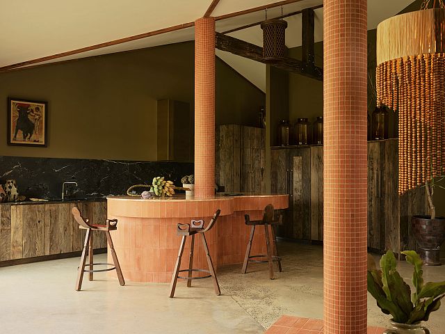 Cotto Manetti Terracotta Arrotato Da Crudo clad kitchen with Magnesia Brushed splashback with Tumbled Square Terracotta Mosaics on the columns at Sun Ranch. Photography by Anson Smart and Styling by Joseph Gardener. Photos courtesy of Sun Ranch.