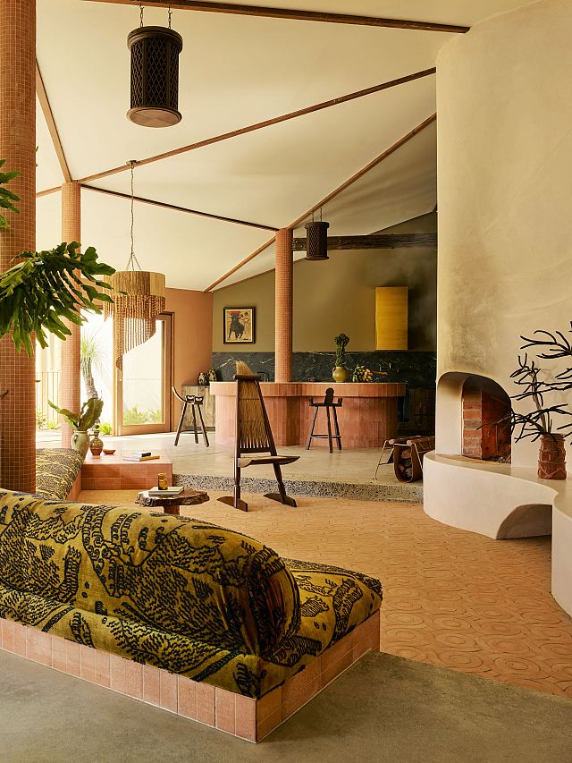 Cotto Manetti Terracotta Arrotato Da Crudo clad kitchen with Magnesia Brushed splashback. Handmade Portofino terracotta tiles line the floor with Tumbled Square Terracotta Mosaics on the columns at Sun Ranch. Photography by Anson Smart and Styling by Jose