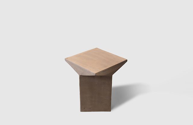 New Volumes Pitcher Stool Marrone — sculptural stool with geometric faceted top in warm tan over a dark brown terracotta cubic base