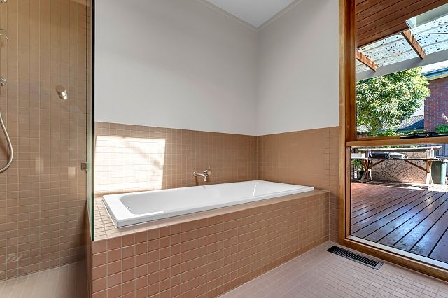 INAX Sugar S1550, paper faced mosaic with terracotta colours is used as floor and walls at Highton House.