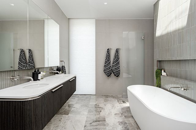 Chroma Chiaro, fiandre porcelain wall tiles, and Teragio, greige marble floor tiles, used at Canberra Residence by Collins Pennington. Photography by Kasey Funnell Photography