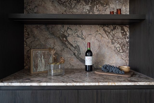 Cosmeria benchtop is a marble with pink, brown, and orange hues.