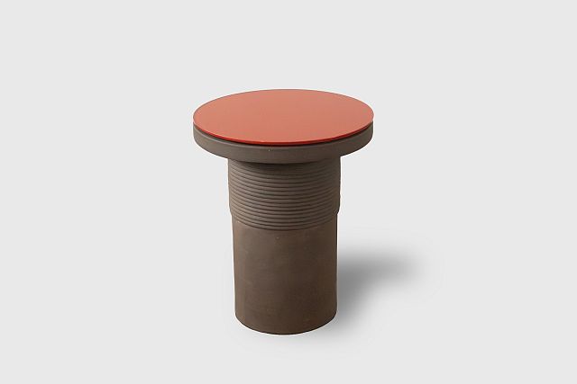 Bound Table designed by Locki Humphrey for New Volumes in marrone terracotta with glass top