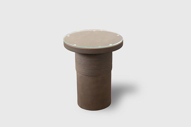 Bound Table designed by Locki Humphrey for New Volumes in marrone terracotta with glass top