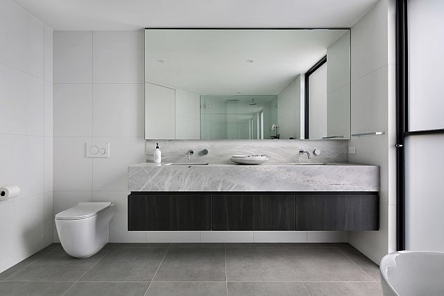 Elba Honed marble to vanity and Fjord Grey Natural to floor. Ashburton residence by De Arch Architects