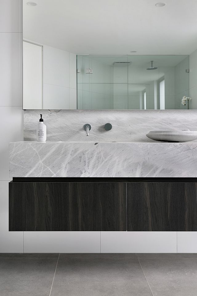 Fjord Grey Natural to floor and Elba Honed marble to vanity. Ashburton Residence by De Arch Architects