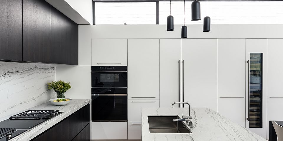 Cortona featured on kitchen bench tops and splash back.jpg