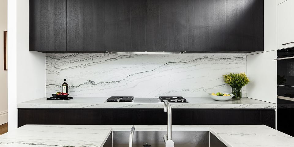 Cortona featured on kitchen bench tops and splash back.jpg