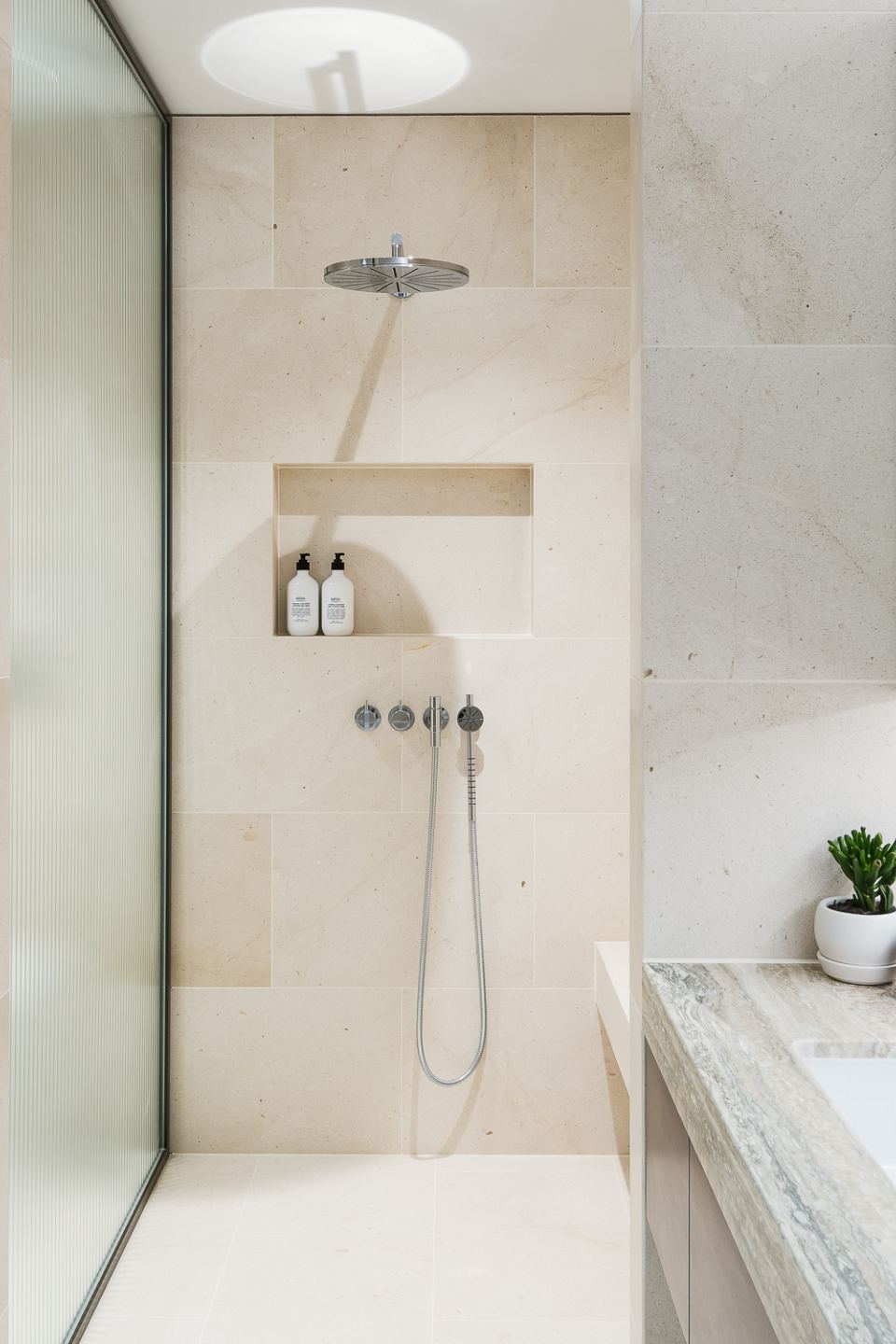 Rocca Bianca honed + Ocean Blue Travertine vanity top. Barker, New Farm by Pike Withers - 03.jpg